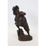 Carved Black Forest figure of a man smoking a pipe, underside signed - 'J.