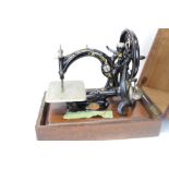 Victorian Willcox & Gibbs sewing machine in a fitted case (some damage)