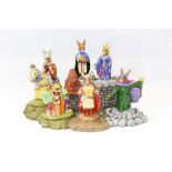 Complete set of Royal Doulton Bunnykins The Arthurian Legends figures and stand (7)