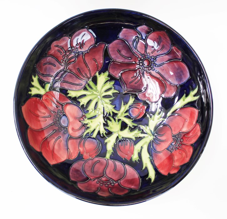 Moorcroft pottery bowl decorated in the Poppy pattern on midnight blue ground, impressed marks,