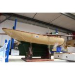 Late 19th / early 20th century pond yacht with cream painted hull, steering gear and mast,