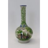 Antique Iznik pottery bottle vase decorated with scenes of buildings amongst trees, 20.