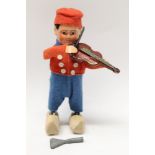 German tinplate clockwork figure of Dutch boy with wooden clogs playing a fiddle,