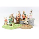 Complete set of Royal Doulton Bunnykins Robin Hood Collection figures and stand (9)