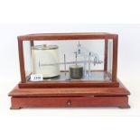 1970s barograph, by Casella, London, in a mahogany case, with separate chart drawer,