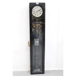 Synchronome electric Master clock with suspension jewel and pendulum in a black case,