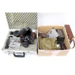 Canon A1 SLR camera with various lenses and accessories in aluminium case with other cameras -