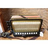 Vintage Hohner one-row button accordion in associated case