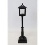 Rare and unusual Continental mid-19th century cast iron novelty light and watch stand in the form