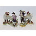 Pair of 19th century German porcelain figures - boy carrying a basket of flowers and seated boy