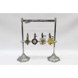 Vintage four-bottle bar stand with optics in chromium plated stand