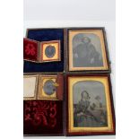 Four 19th century ambrotype portraits with gilt metal surrounds,