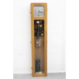Synchronome electric Master clock with suspension jewel and pendulum, in a light oak case,