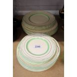 Clarice Cliff part dinner service with green and gilt banding (23 pieces)