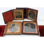 Four 19th century ambrotype portraits with gilt metal frames in leather cases