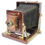 Nationa Camera Company mahogany and brass folding field plate camera fitted with a 7.