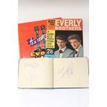 Autographs in small album - The Rolling Stones, Brian Jones (on separate page), Mick Jagger,