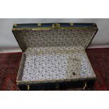 Large blue and black steamer trunk with metal trim and fastenings, by Langmuir,