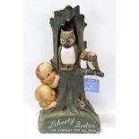 Shop display 'Wise Mothers buy Liberty Bodices' mother owl and two owlets on tree stump with two