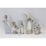 Five Lladro porcelain figures - clown with accordion, girl with teddy, girl holding piglet,