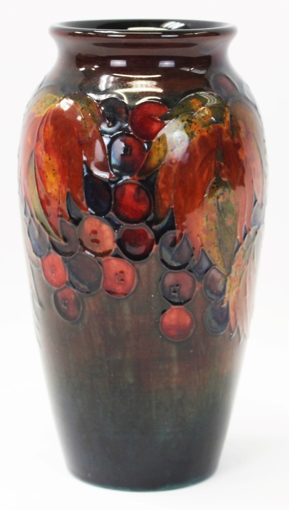 1930s Moorcroft pottery flambé glazed vase decorated in the Leaf and Berry pattern,