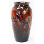 1930s Moorcroft pottery flambé glazed vase decorated in the Leaf and Berry pattern,