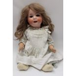 Doll - Heubach Koppelsdorf bisque head 300-7 - highly coloured face, blue sleeping eyes,