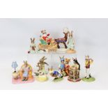 Eleven Royal Doulton Bunnykins figures - Dashing Through The Snow, All Tucked In, Aussie Surfer,
