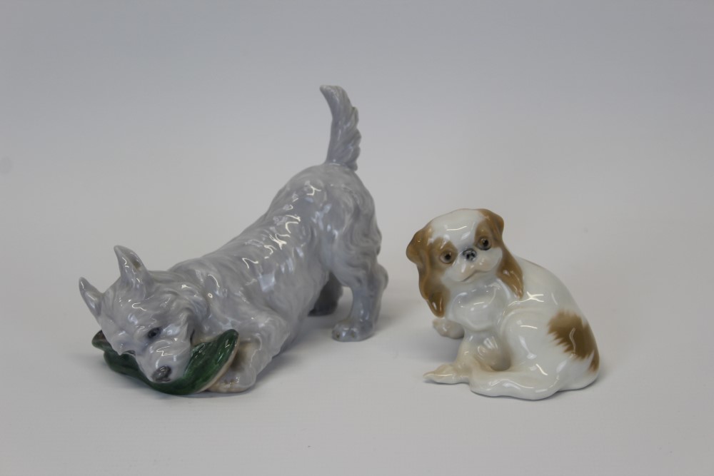 Royal Copenhagen porcelain model of a terrier chewing a slipper,