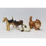 Four Beswick models - donkey, cat,