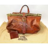 Vintage large brown leather Gladstone bag by The Bridge, brass frame closure,