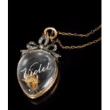 Late Victorian locket with a glazed compartment with intaglio engraved name - 'Violet' and diamond