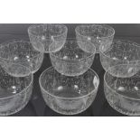 Eight Victorian etched glass finger bowls with classical scroll decoration,