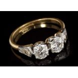 Diamond two-stone ring with two old cut diamonds in platinum claw setting,