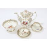Early 19th century English Rockingham-type tea and coffee service with painted floral sprays within