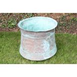 Large copper vessel of waisted form, with everted rim,