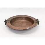 Substantial antique copper bowl of dished form, with twin handles,