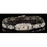 Good quality 1930s ladies' diamond and platinum cocktail watch with integral articulated diamond
