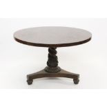 Early Victorian carved oak breakfast table with circular tilt-top,