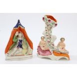 Victorian Staffordshire spill vase in the form of a cornucopia with two putti,