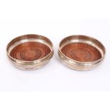 Pair contemporary silver coasters of circular bellied form,
