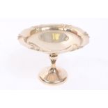 1930s silver tazza of dished form, with shaped rim on a tall pedestal foot (Birmingham 1933),