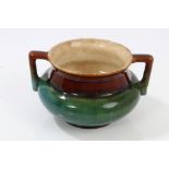 Dr Christopher Dresser designed Linthorpe art pottery pot with twin handles and green,