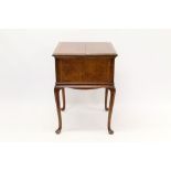 Art Deco walnut and grained 'surprise' drinks cabinet of square form,