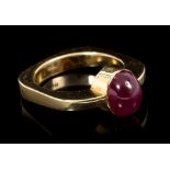 Ruby single stone ring with an oval cabochon ruby measuring approximately 9mm x 7mm x 4.