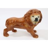 Late 19th century Staffordshire lion ornaments with glass eyes,
