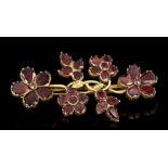 George III garnet floral spray brooch with four flower heads amongst foliage,