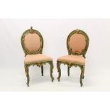 Pair of antique green painted and gilt chinoiserie salon chairs with pink satin oval pad back and