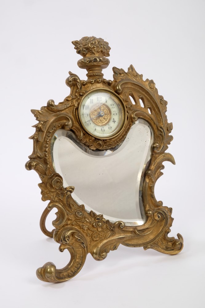 Late 19th century French gilt metal 'strut' clock with rococo scroll and bevelled mirrored panel, - Image 2 of 4