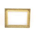 Large 19th century gilt gesso frame - allover C-scroll ornament with scrolling shell angles,